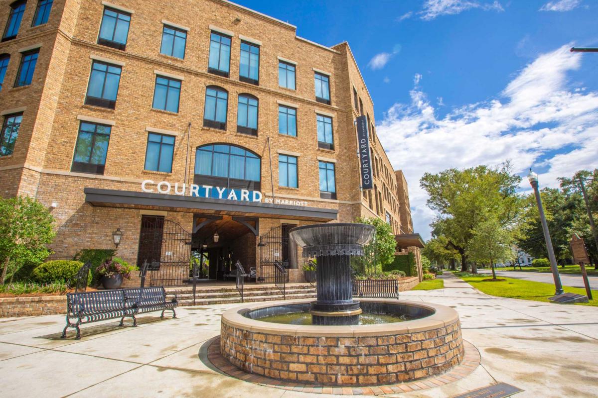 New Courtyard Marriott, the design of which was influenced by the Blueprint plan. As opposed to the original concept, the building was brought up to the street, a terminated vista/fountain was added t