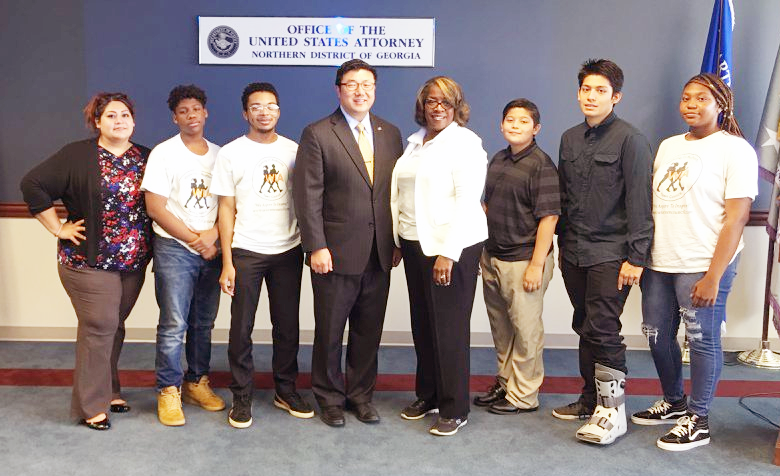 Walking in Authority Teen Council members at the 6th Annual Youth Legal and Law Enforcement Symposium in 2018 with then U.S. with then U.S. Attorney B.J. Pak.