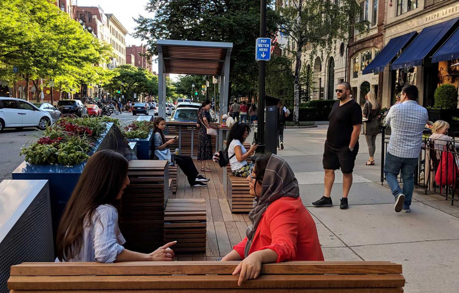 Parklets repurpose on-street parking spaces as mini public parks in Boston. This one was designed by Kyle Zick Landscape Architecture, Inc. Photo credit: Utile Inc.
