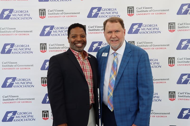 Michael Owens, newly elected mayor for the City of Mableton, stands with GMA’s Executive Director and CEO, Larry Hanson, at the 2023 Georgia Municipal Association’s Annual Convention in Savannah. 